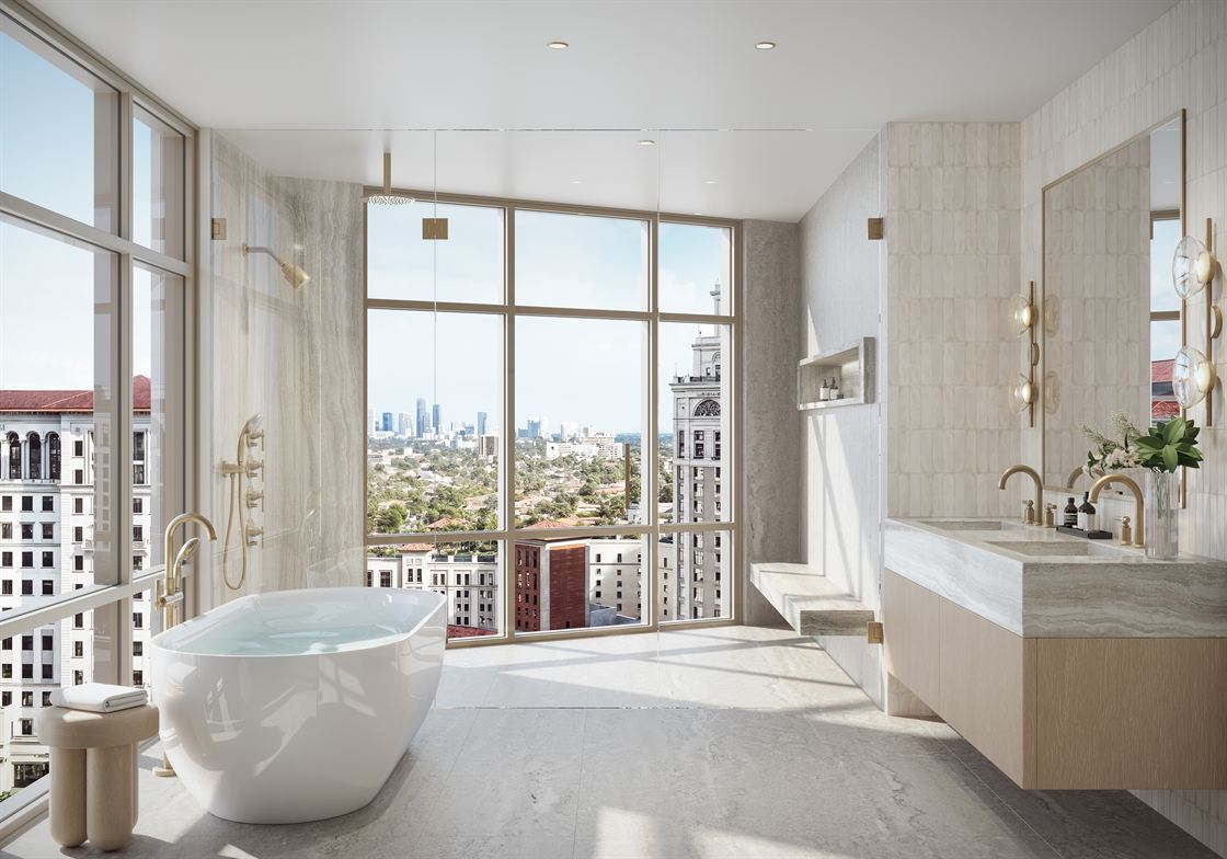 Primary bathroom finished in natural stone